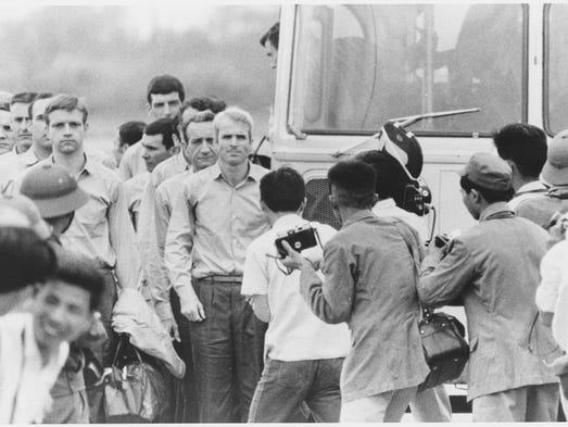 John McCain waiting for the rest of the group to leave