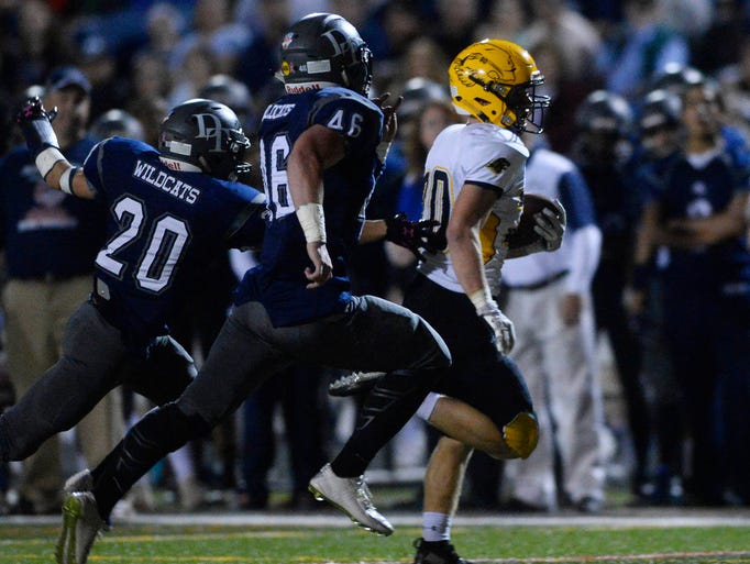 Red Lion's Alex Keough is chased down by Dallastown's