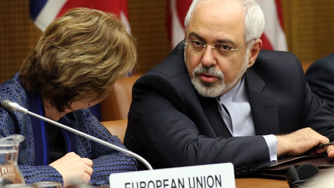 European Union's High Representative for Foreign Affairs and Security Policy Catherine Ashton, left, and Iranian Foreign Minister Mohammad Javad Zarif wait for the start of closed-door nuclear talks in Vienna, Austria, on June 17.