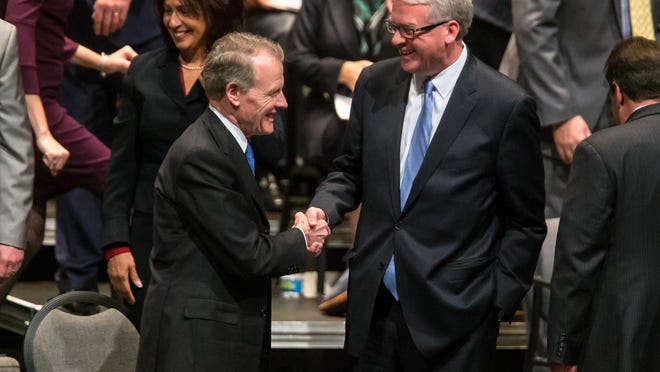 Illinois Speaker of the House Michael Madigan, D-Chicago, shakes hands with Illinois House Minority Leader Jim Durkin, R-Western Springs, prior to the inauguration ceremony for the Illinois House of Representatives for the 101st General Assembly at the University of Illinois Springfield's Sangamon Auditorium, Wednesday, Jan. 9, 2019, in Springfield, Ill.