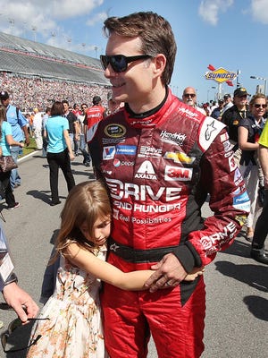 Jeff Gordon's daughter Ella hugs him before the start of the Daytona 500 NASCAR Sprint Cup race at Daytona International Speedway.