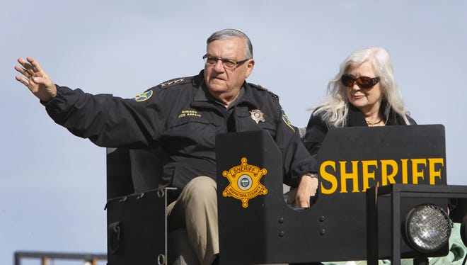 Maricopa County Sheriff Joe Arpaio and his wife, Ava Arpaio, make their way along Central Avenue during the Fort McDowell Fiesta Bowl Parade Dec. 29, 2012 in Phoenix. Ava Arpaio, who has been battling cancer, has received word from doctors that her cancer is in "complete remission," her husband announced  May 1, 2018.