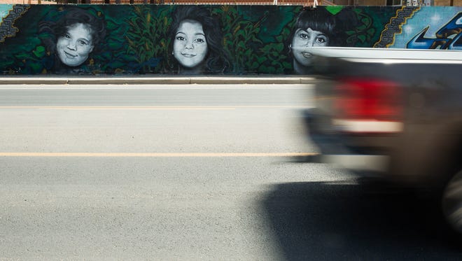 A mural depicting the Kardashian sisters when they were young painted on a wall along Locust Avenue, Tuesday, June 6,2017.