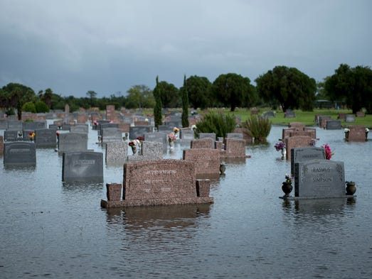 A graveyard is seen as it floods during the aftermath