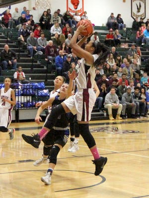 Elmira's Zaria DeMember-Shazer goes in for a layup against Horseheads on Saturday in a Section 4 Class AA semifinal.