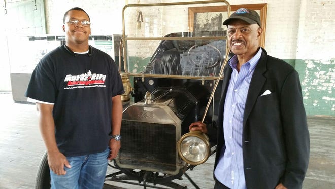 Carlton Dennard, left, of Motorcity Horsepower and CruisIN' the D' founder Gregory Reed attend a car collectors meeting.