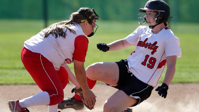 Kimberly's Carleigh Johnson (right) slides safely into second base against Neenah's Karly Jackson during a WIAA Division 1 regional final softball game May 29, 2014 at Sunset Park in Kimberly.