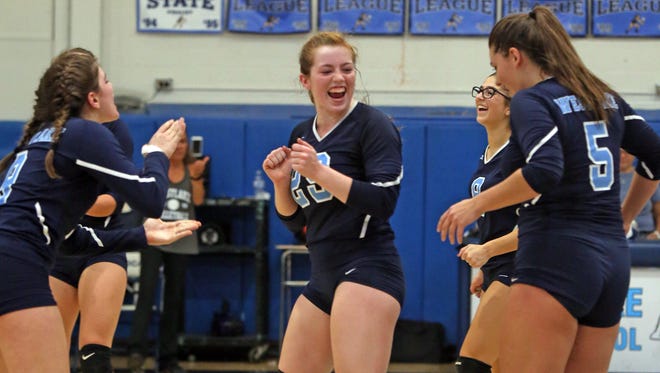Westlake's Caleigh Carr (29) celebrates with her teammate after winning a point against Ardsley during Section 1 Class B girls volleyball semifinal at Westlake High School in Thornwood Nov. 3, 2016. 