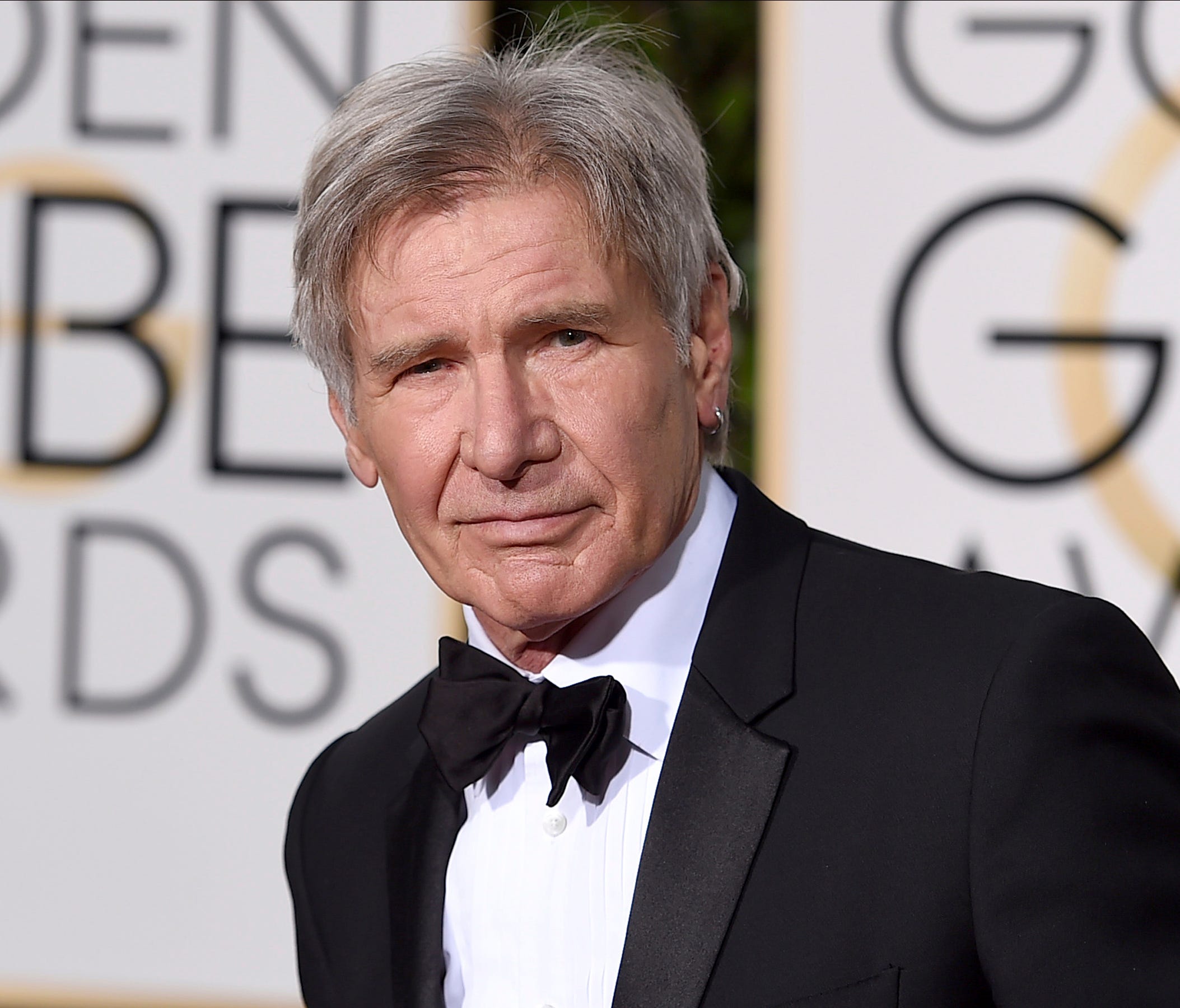 Harrison Ford is pictured arriving at the 73rd annual Golden Globe Awards in Beverly Hills, Calif. Newly released video showed a plane piloted by Ford mistakenly flying low over an airliner that was taxiing at a Southern California airport.
