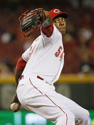 Reds relief pitcher Aroldis Chapman delivers against the Braves on May 12.