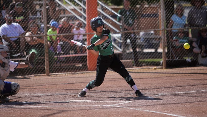 Farmington's Meghan Shim hits a single against Bloomfield during a District 1-5A game on Friday, April 27 at Ricketts Softball Complex. The Lady Scorpions, who are averaging 11.8 runs scored per game since March 23, enter the 5A state tournament as the No. 5 seed.