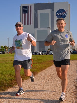 Kennedy Space Center director Robert Cabana, right, is not only known as a former astronaut, but as a dedicated athlete.