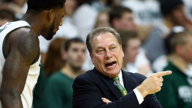 Michigan State head coach Tom Izzo talks to Branden Dawson during the first half of Sunday's game against Northwestern at Breslin Center.