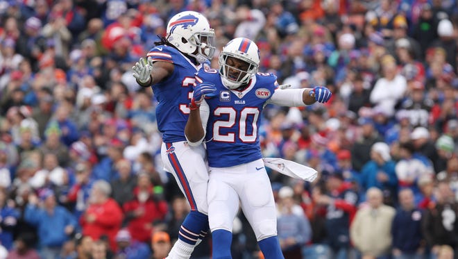 Buffalo Bills cornerback Corey Graham (20) celebrates with teammate defensive back Nickell Robey (37) after intercepting a pass intended for the Cleveland Browns during the first half at Ralph Wilson Stadium.