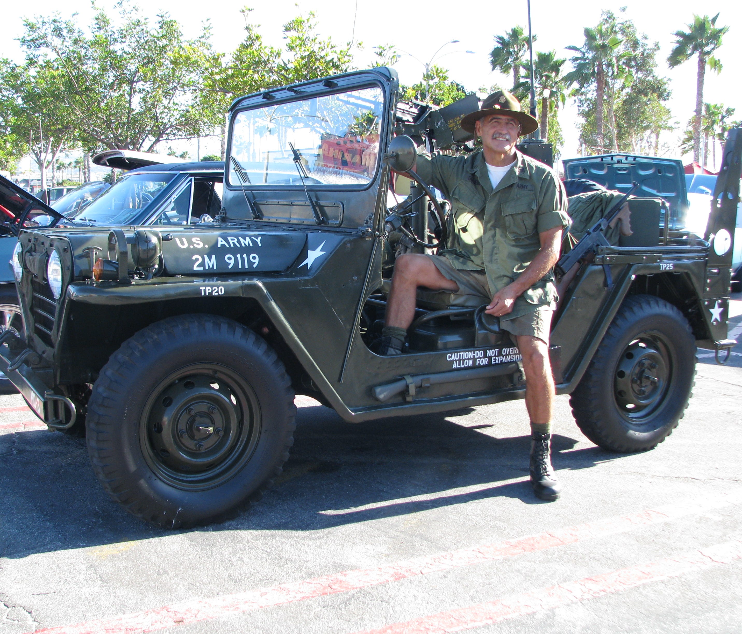 Carl Gutierrez of Rancho Palos Verdes, Calif., shows off his M151A1, a MUTT. His is a 1966 model, a tribute to those who served in civil defense in the Vietnam era.