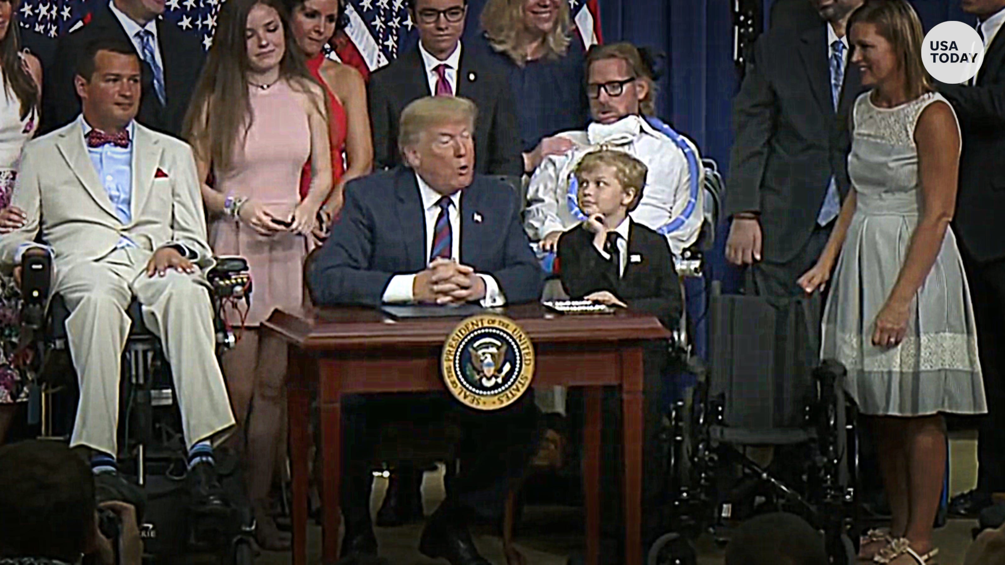 Little boy and President Trump's tender moment at bill signing