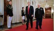 President Trump and retired Army Capt. Gary Rose walk