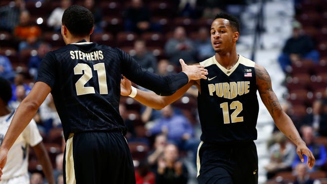 Purdue forward Vince Edwards (12) and guard Kendall Stephens (21) celebrate against Old Dominion during the second half at Mohegan Sun Arena.
