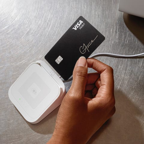 A person inserting their Cash Card into a Square p