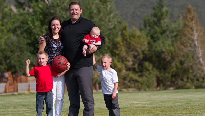 Southern Utah men's basketball coach Todd Simon with his wife, Kati, and their children.
