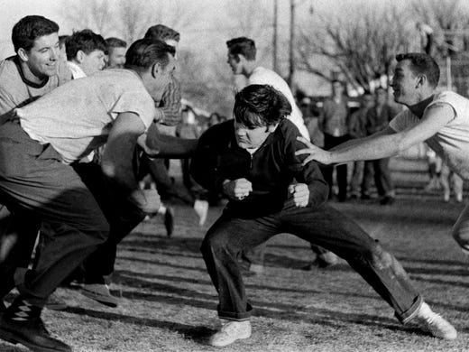 Elvis Presley playing touch football at the Dave Wells