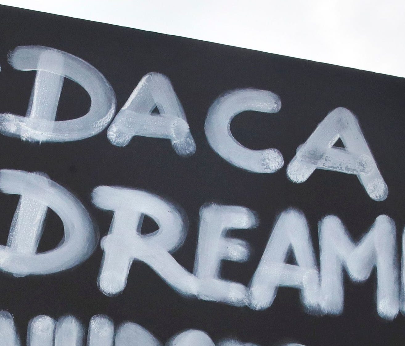 Nursing student Carlos Esteban, a DACA recipient,  rallies outside the White House on Sept. 5, 2017.