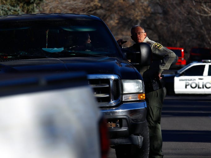 A San Juan County sheriff's deputy directs traffic