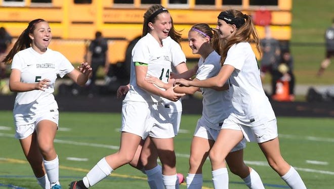 From left, Spackenkill's Caitlin Speranza, Katherine Lillis, Maria Barefoot, and Kaitlin Kilpert celebrate the goal Barefoot got on Rhinebeck during the Section 9 Class C final held in Marlboro on Saturday.