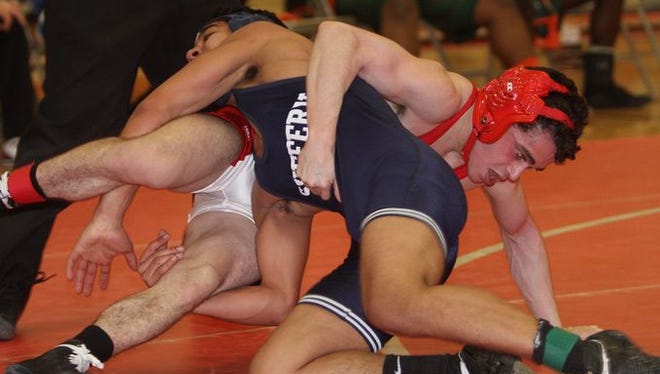 Anthony Sulla from North Rockland, top, defeated Luis Cuevas from Suffern in the 113-pound match during the Rockland County Championships wrestling tournament at Tappan Zee High School, Jan. 31, 2015.