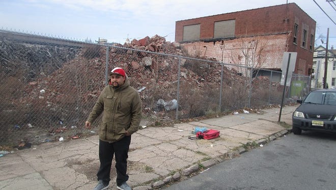 Paterson resident Eric Hunter in front of the remains of the Leader Dye factory in the city's 3rd Ward, only one block from his home.