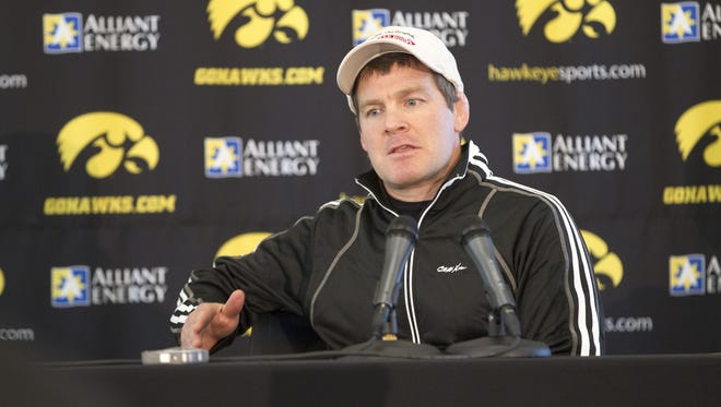Iowa wrestling head coach Tom Brands responds to questions during Iowa wrestling media day at Carver-Hawkeye Arena on Thursday, Nov. 6, 2014.