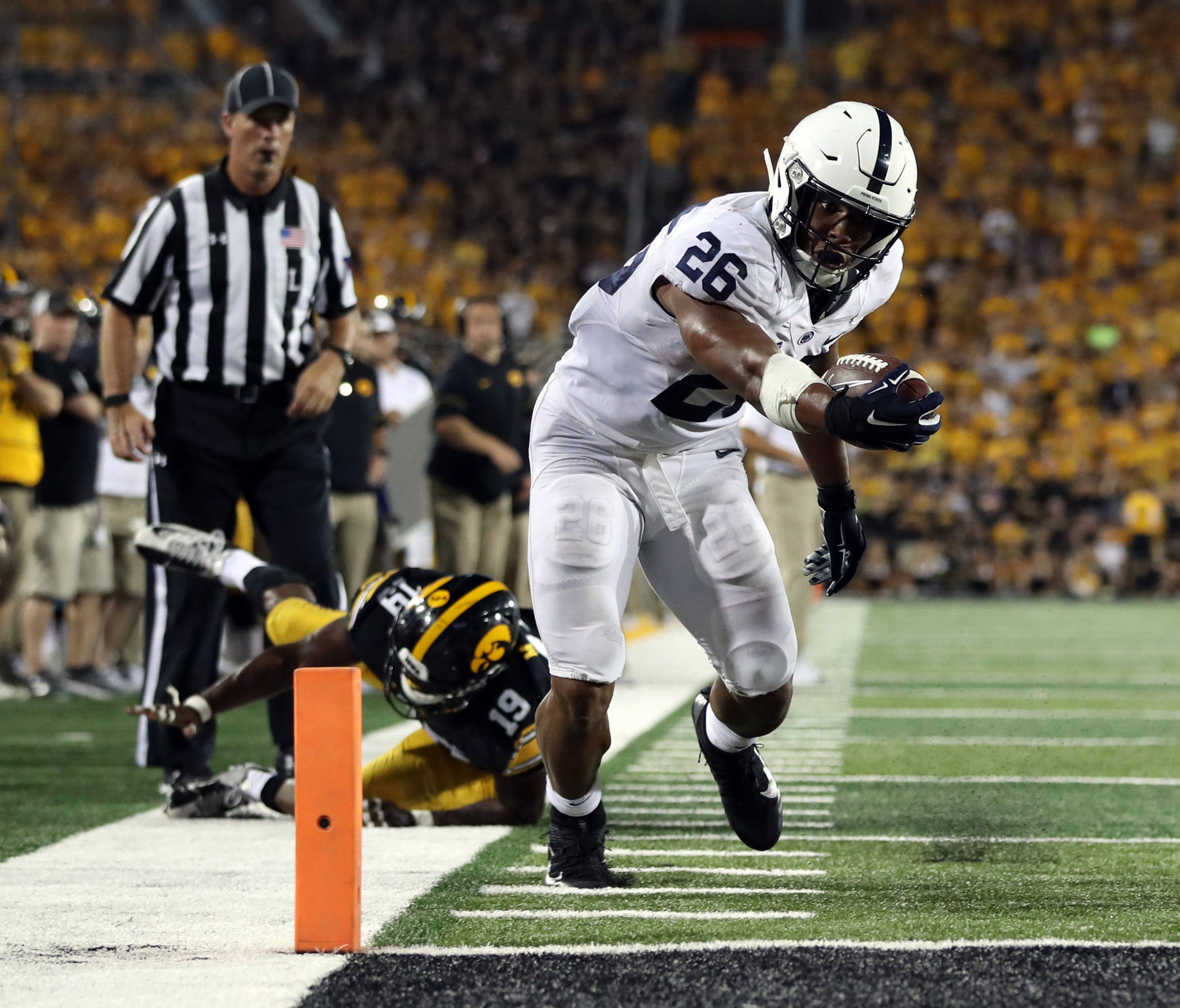 Penn State running back Saquon Barkley scores a touchdown against Iowa during the third quarter at Kinnick Stadium.