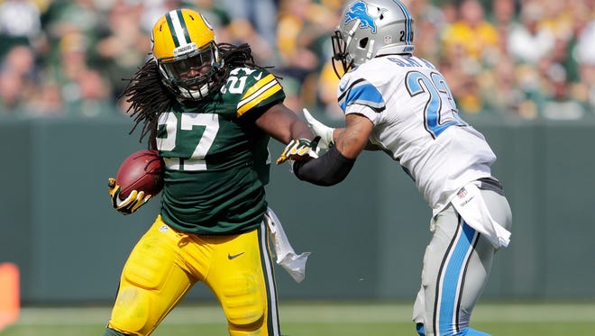Green Bay Packers' Eddie Lacy makes the edge against  Detroit Lions' Darius Slay. The Green Bay Packers host the Detroit Lions during on Sunday, September 25, 2016, at Lambeau Field in Green Bay, Wis.
