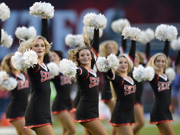 Scenes of college football: Spirited cheerleaders, passionate fans