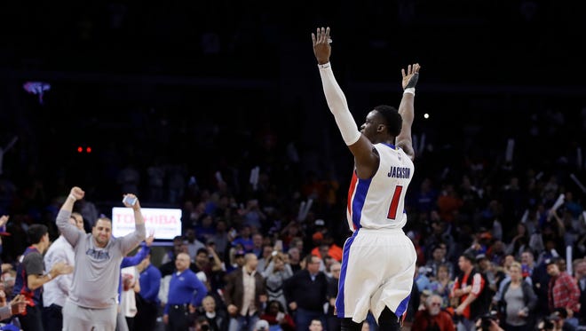 Reggie Jackson plays to the crowd during the final seconds of the Pistons' win over the Thunder.
