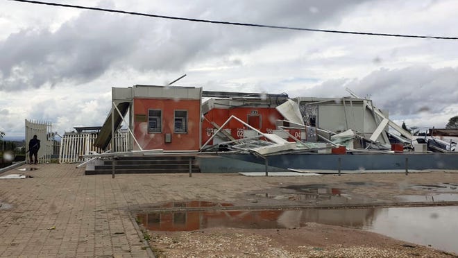 In this photo provided by United Nations Children's Agency (UNICEF), damaged buildings are seen after Cyclone Kenneth made landfall in Pemba, Mozambique, Friday, April 27, 2019.