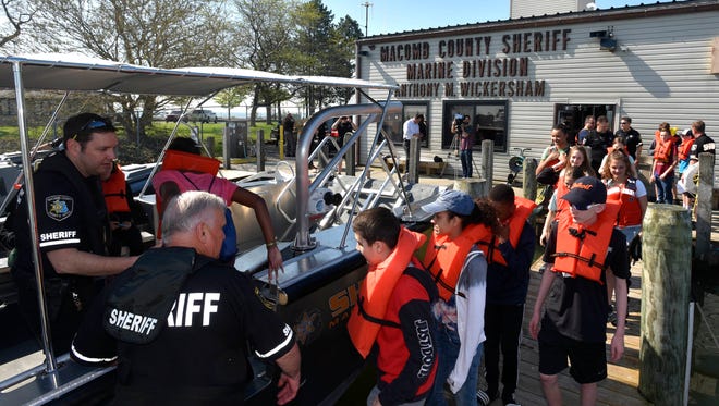 Students board PB (patrol boat) 8, the marine division's new 32-foot Munson Pakcat search and recovery dive boat for their tour of Lake St. Clair.
XXXXOne hundred seventh-grade students from Chippewa Valley Schools, all of whom scored a 100% on their boaters' safety course, tour the Macomb County Sheriff's Office (MCSO) Marine Division Boathouse, in Harrison Twp., and ride on patrol boats on Lake St. Clair, Thursday morinng, May 24, 2018. MCSO deputies teach more than 6000 county students the 'Boat Michigan-A Course on Responsible Boating,' during the winter months. Hundreds of students, scoring a 100% on this course, are rewarded with this tour during the 2018 National Safe Boating Week, May 19-25.