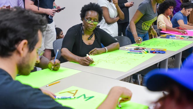 Barbara King joins other concerned citizens at the LSU African American Cultural Center to make protest signs. July 7, 2016.