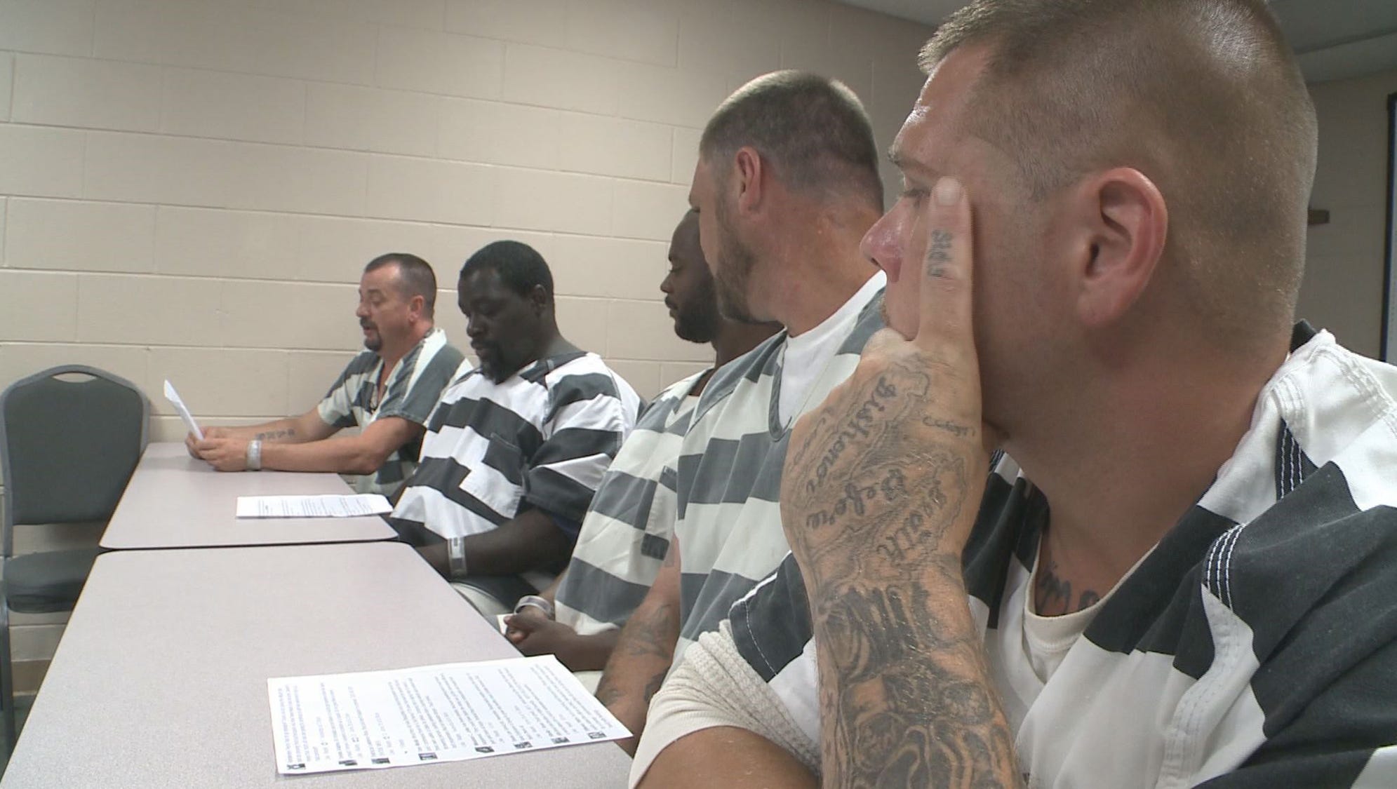 Inmates' kindness They saved deputy, but are surprised by attention