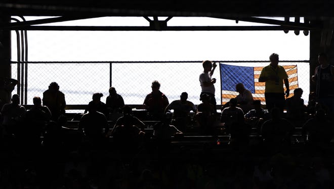 Fans watch during the Brickyard 400 at Indianapolis Motor Speedway on July 24, 2016.
