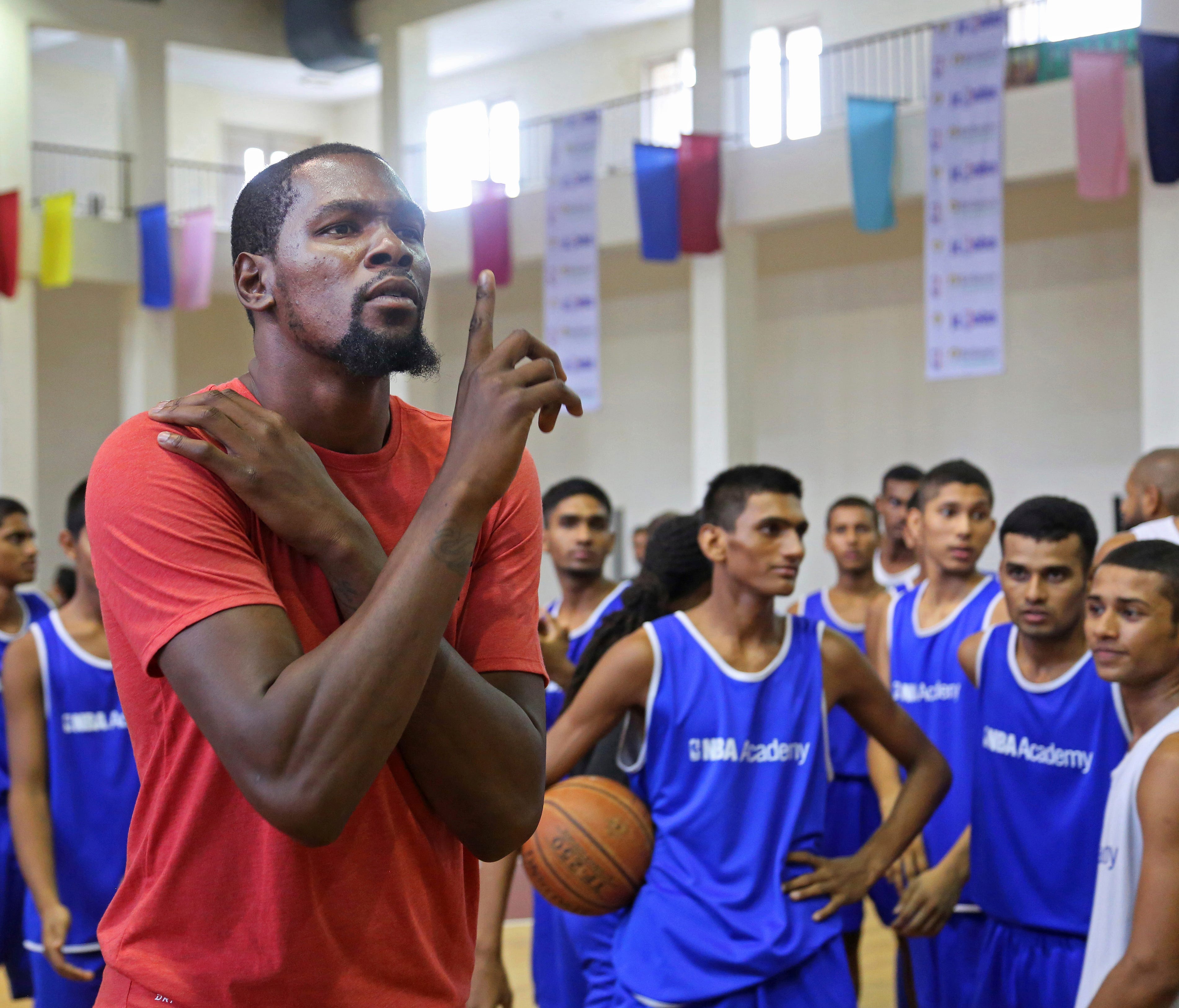 Kevin Durant gestures during his tour of NBA Academy in Greater Noida near New Delhi, India.