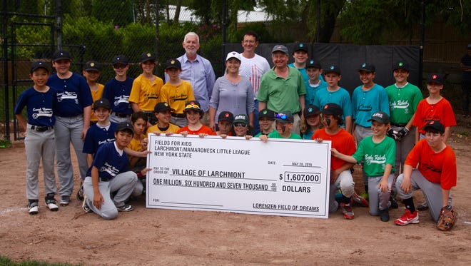 A check for $1.6 million check — all raised by Fields for Kids — was presented to Larchmont Mayor Lorraine Walsh for the construction of a new baseball complex at Lorenzen Park.