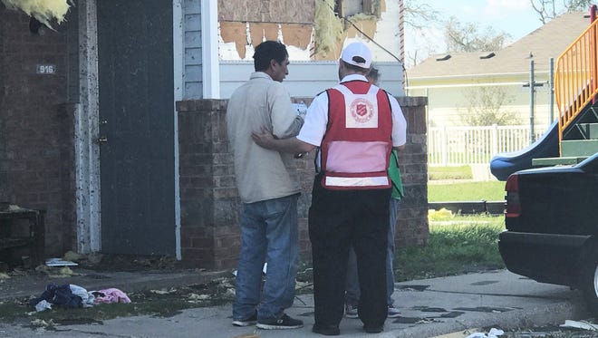 Salvation Army Capt. Patrick Gesner speaks with an individual whose residence was damaged by Hurricane Harvey. The storm made landfall in the Coastal Bend on Aug. 25 as a Category 4 hurricane with winds of over 130 mph.