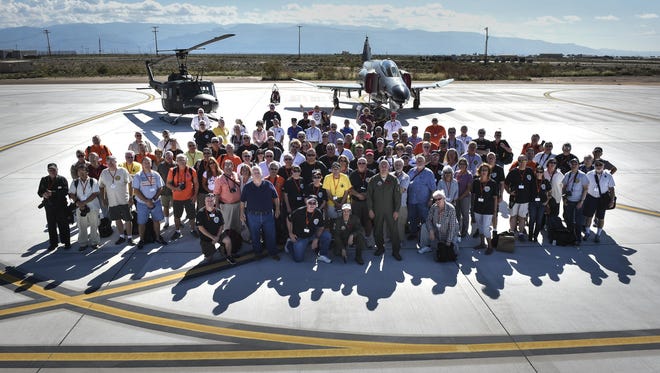 All 160 Phantom Society participants pose for a picture Sept. 13 at Holloman AFB. The Phantom II society is an international non-profit dedicated to the preservation of the history of the McDonnell Douglas F-4 Phantom II fighter. The tour enabled aircraft enthusiasts, including veterans and non-veterans with aviation backgrounds, to explore various base locations. The tour included an F-16 Fighting Falcon static and briefing, travel to Holloman’s High Speed Test Track, the opportunity to view QF-4s and F-16s in flight, and a visit to Heritage Park to view statics displays of various aircraft flown at Holloman AFB.