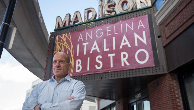 Tom Agosta, owner of Angelina Italian Bistro, poses for a portrait outside of his restaurant located in the M@dison Building on Thursday, Dec. 15, 2016 in Detroit. 