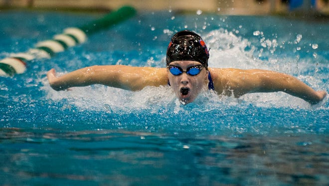 St. Clair swimmer Grace Shinske competes in the 100 Yard Butterfly at the state swim meet at Eastern Michigan University in Ypsilanti, Mich. on Saturday, Nov. 21, 2015.