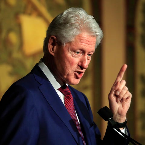 Former president Bill Clinton speaks during a...