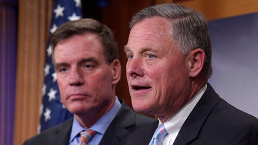 Senate Intelligence Committee Chairman Sen. Richard Burr, R-N.C., right, and the committee's Vice Chairman Sen. Mark Warner, D-Va. meet with reporters on Capitol Hill in Washington, Wednesday, March 29, 2017, to discuss the committee's investigation of Russian interference in the 2016 election.