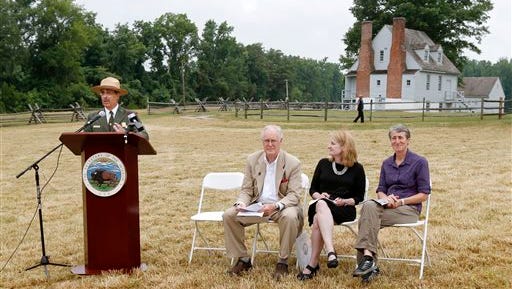 Dave Ruth, superintendent of Richmond National Battlefield Park, speaks near the Watts house on the Gaines' Mill Battlefield at a ceremony where 285 acres on the Gaines' Mill Battlefield from the Civil War Trust were transferred to the Richmond National Battlefield Park, Thursday, July 10, 2014, in Richmond, Va.  O. James Lighthizer, second from right, president of the Civil War Trust, and Virginia Secretary of Natural Resources Molly Ward and U.S. Interior Secretary Sally Jewell, right, listen.