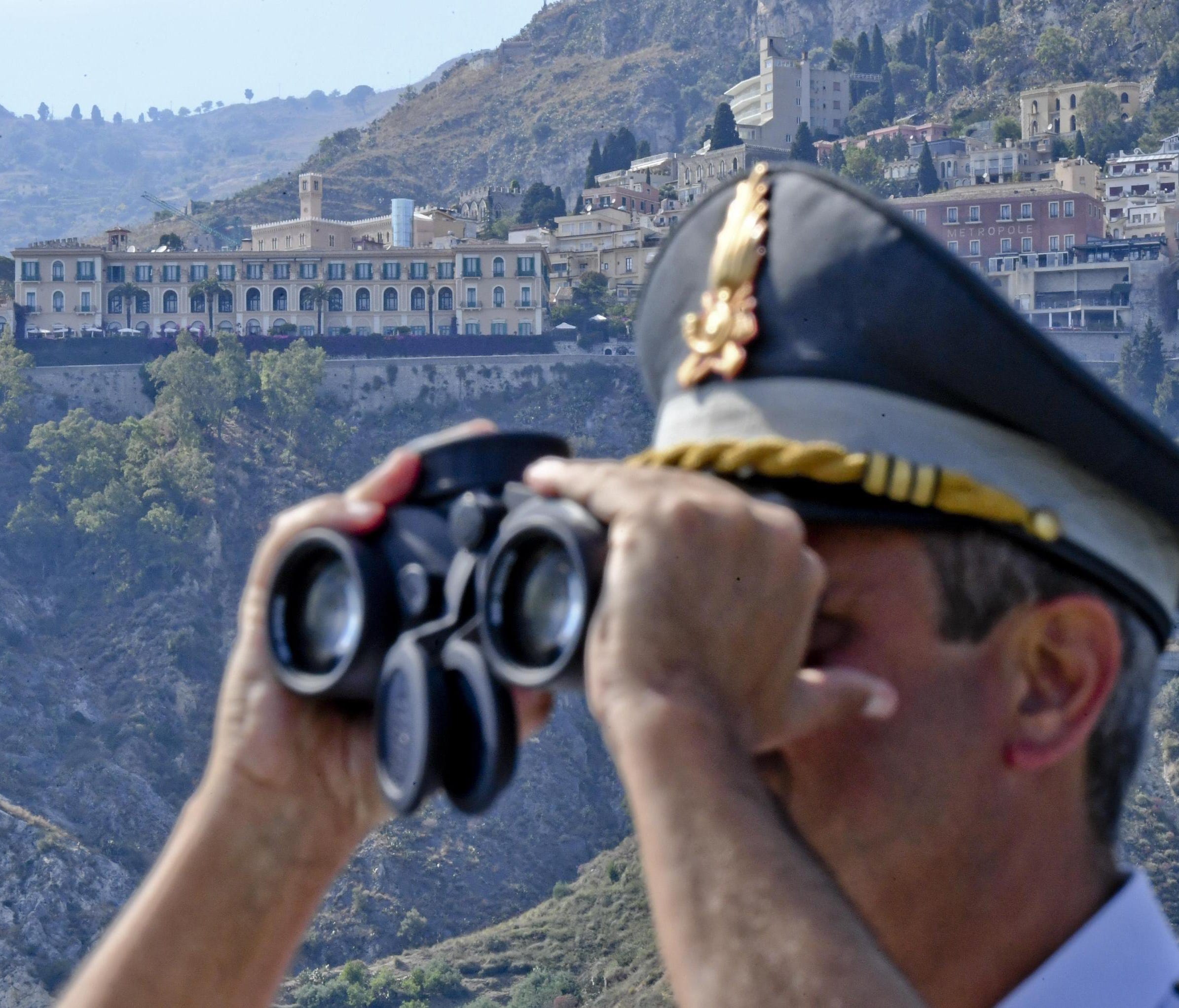 An officer of Italian Guardia di Finanza at work ahead of the G-7 summit near the Sicilian town of Taormina on May 25,  2017.